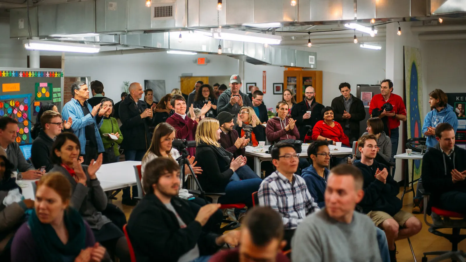 STEAM audience applauds member at event