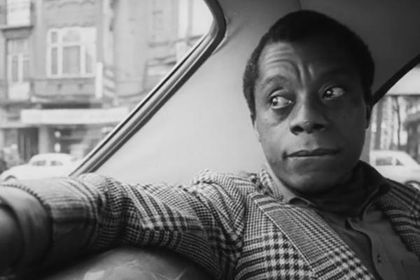 James Baldwin riding in a vehicle
