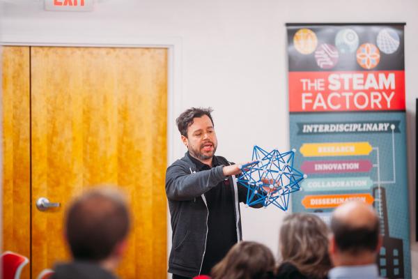 Speaker Dr. Kahle Dr. Kahle holding a shape