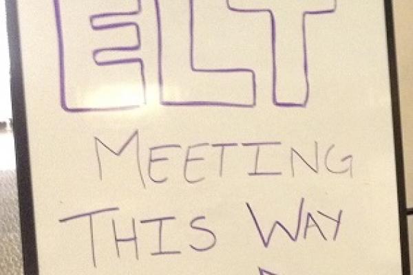 sign that says "ELT meeting this way"