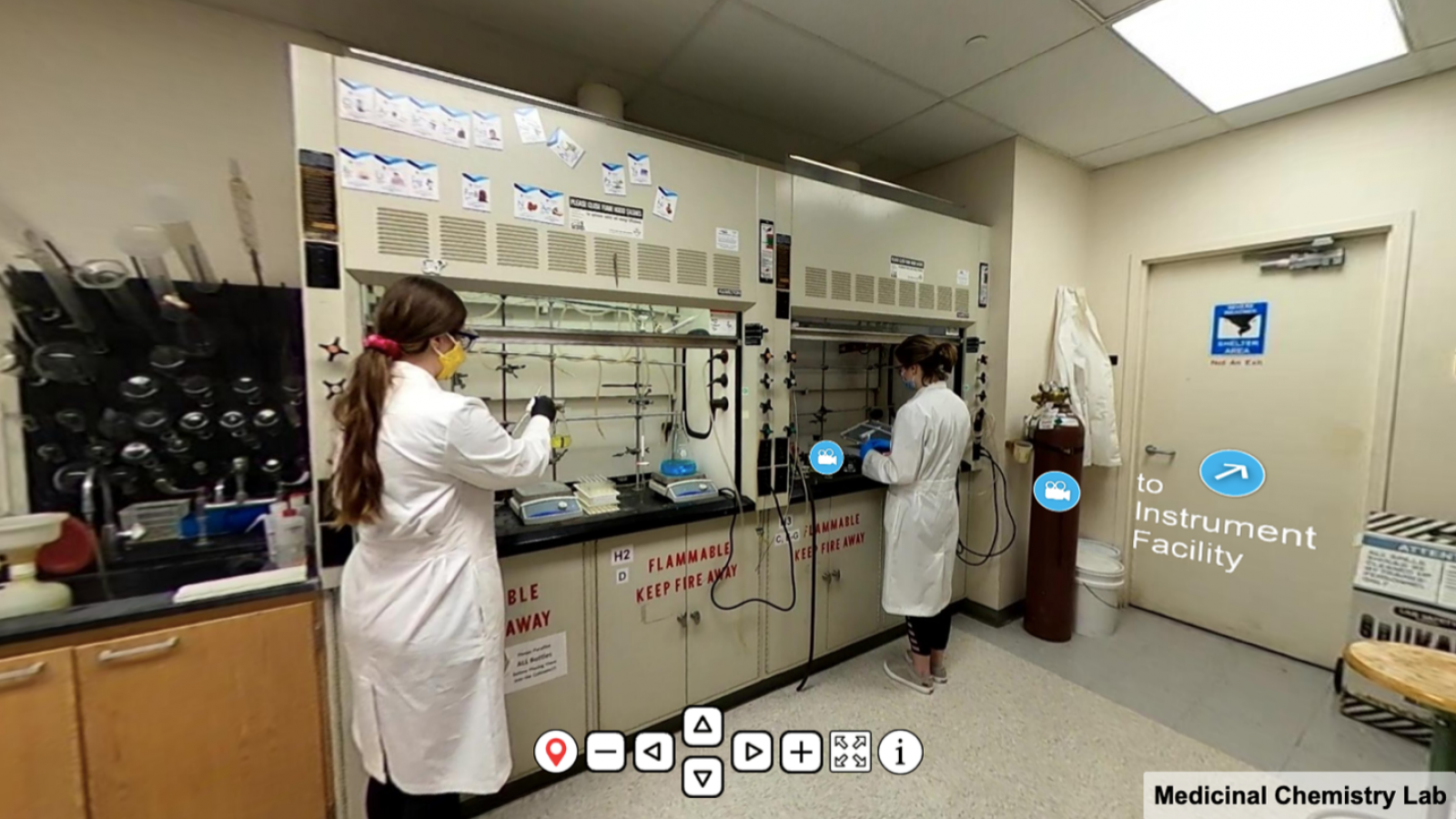The Ohio State University College of Pharmacy tour showing scientists working in their lab. 