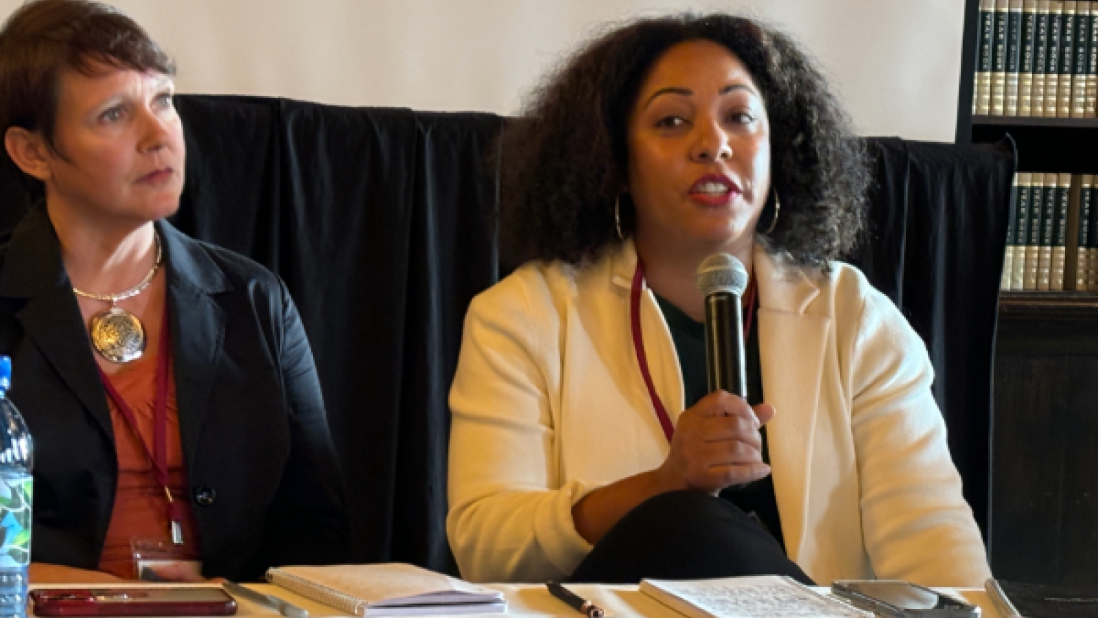 Woman seated with microphone